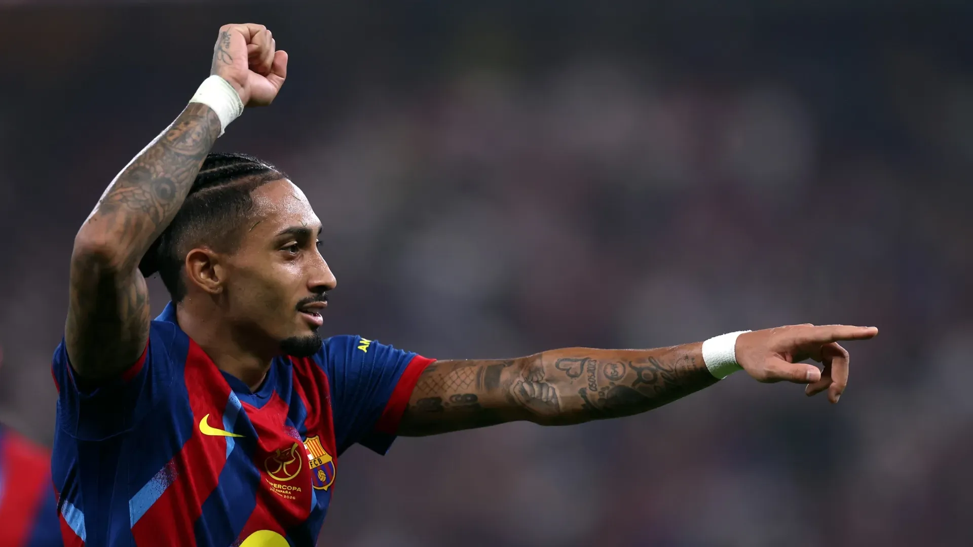 Raphinha do FC Barcelona comemorando.