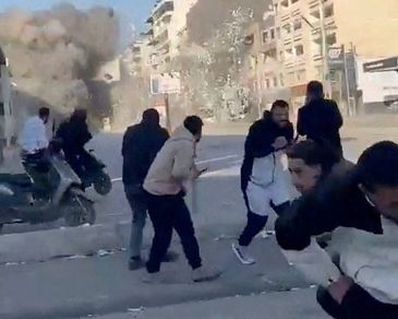 People run as a missile hits a building, following an escalation between Hezbollah and Israel amid the U.S.-Israel conflict with Iran, in Tyre, Lebanon, in this screen grab obtained from a social media video released March 2, 2026. Social Media/via REUTERS  THIS IMAGE HAS BEEN SUPPLIED BY A THIRD PARTY. MANDATORY CREDIT. NO RESALES. NO ARCHIVES. 
Verification: 
-Buildings, shopfronts, road layout and petrol station matched file and satellite imagery
-Exact time could not be verified
-However, Israel said it launched a wave of strikes in southern Lebanon on Monday (March 2)
-No older versions of the video found before Monday (March 2)