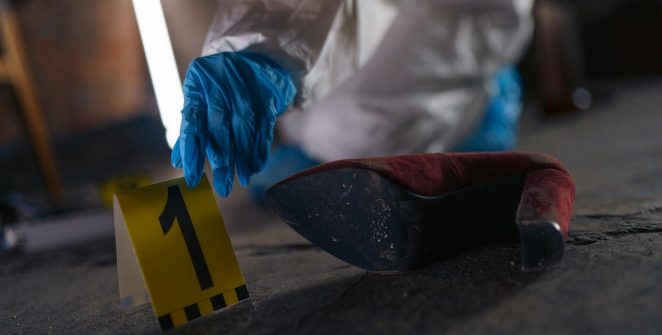 Crime scene investigation with shoe as evidence marked with number one and forensic glove.