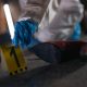 Crime scene investigation with shoe as evidence marked with number one and forensic glove.