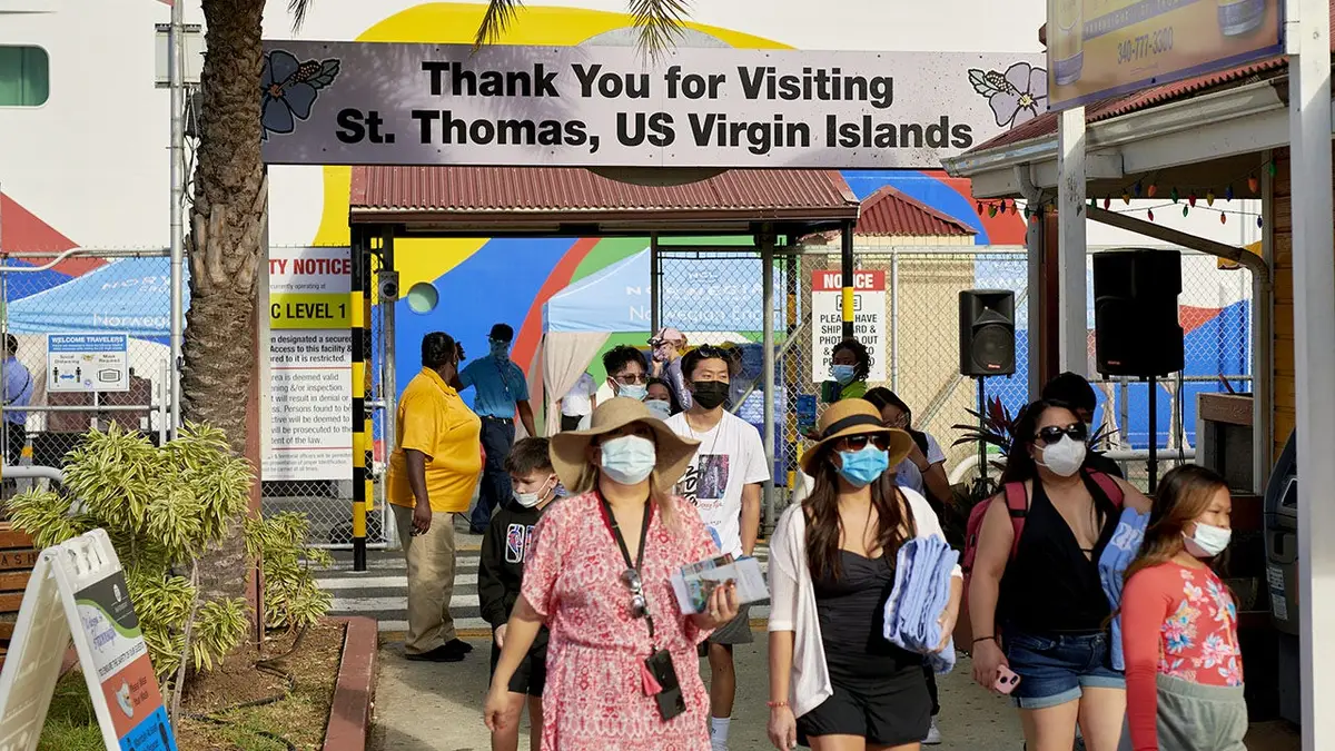 Passengers exiting Norwegian Encore and Regal Princess cruise ships at West Indian Company Dock in Charlotte Amalie