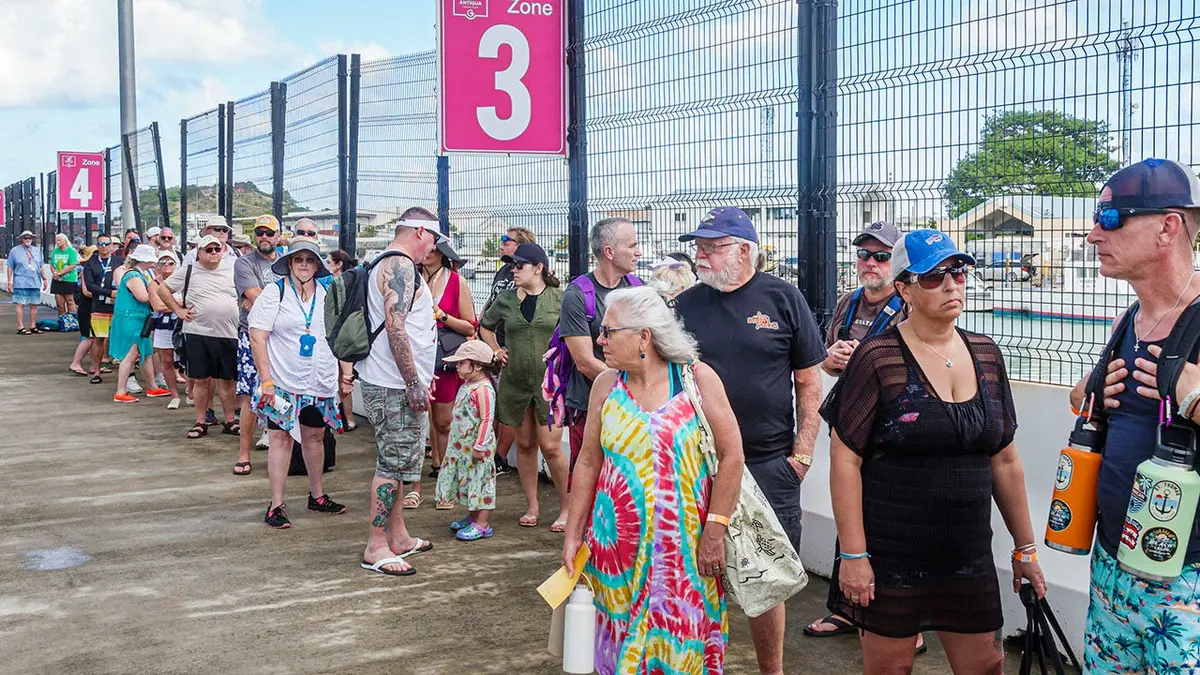 Passengers from Norwegian Cruise Line Breakaway ship waiting in a queue in St John's Antigua and Barbuda