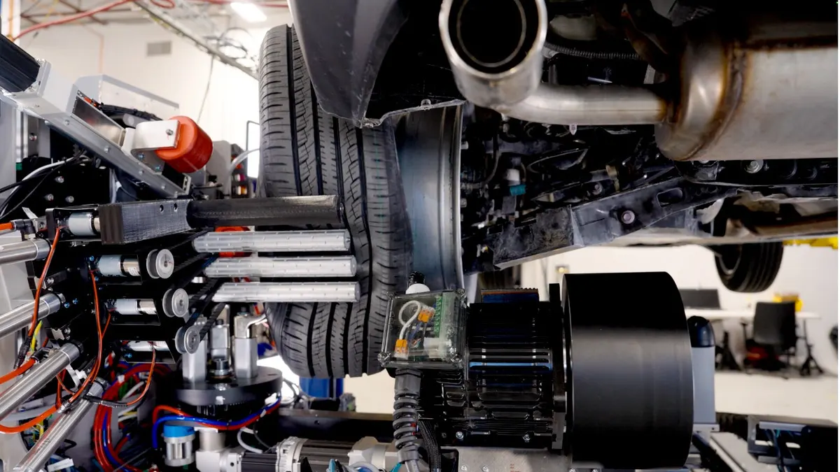 A robotic system changes a tire.