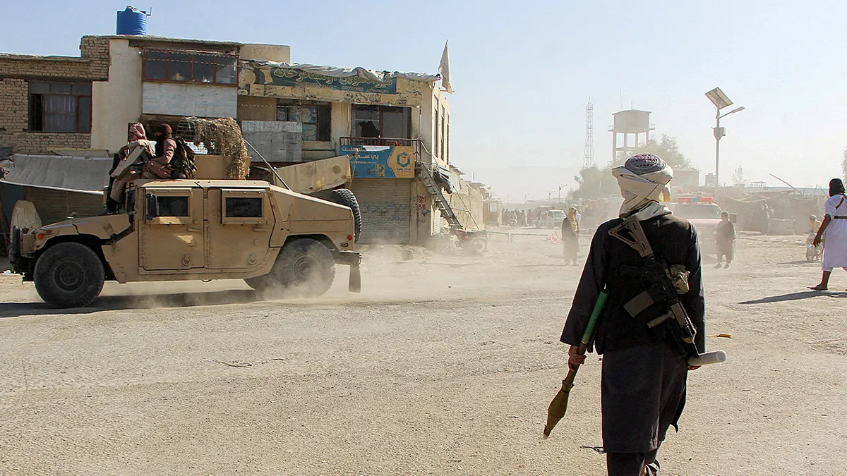 Afghan Taliban fighters patrolling near Afghanistan-Pakistan border in Spin Boldak
