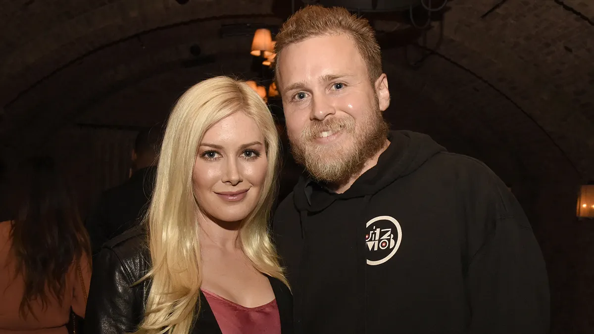 Heidi and Spencer Pratt standing together at an engagement dinner in West Hollywood