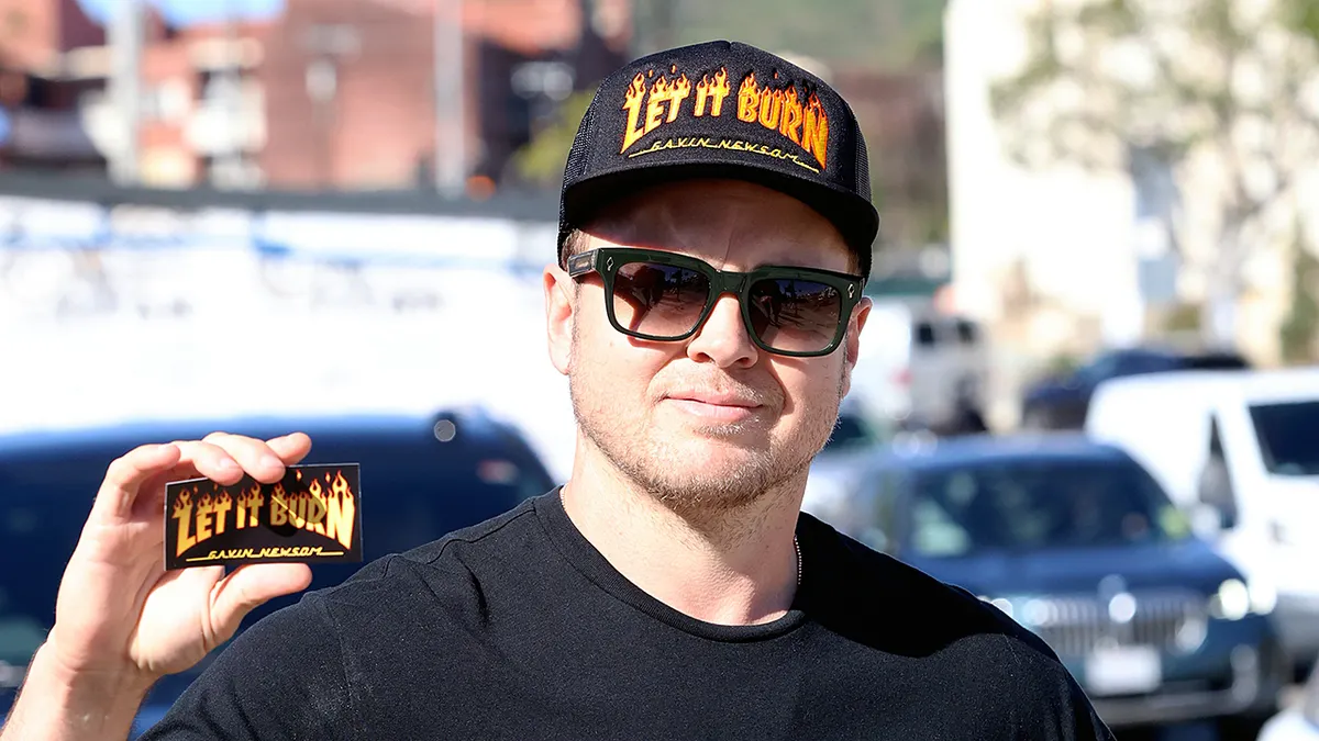 Spencer Pratt wearing a hat that says Let It Burn Gavin Newsom in Pacific Palisades