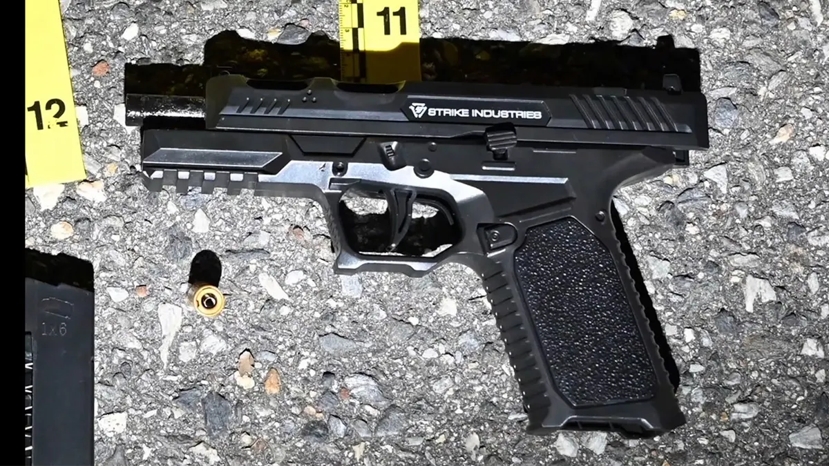 replica firearm recovered from scene with evidence markers