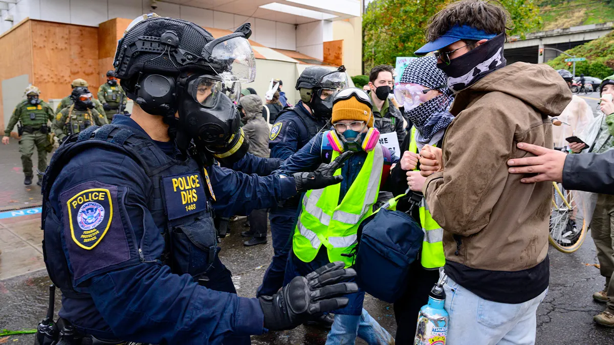Federal agents clashing with anti-I.C.E. protesters outside U.S. Immigration and Customs Enforcement building in Portland