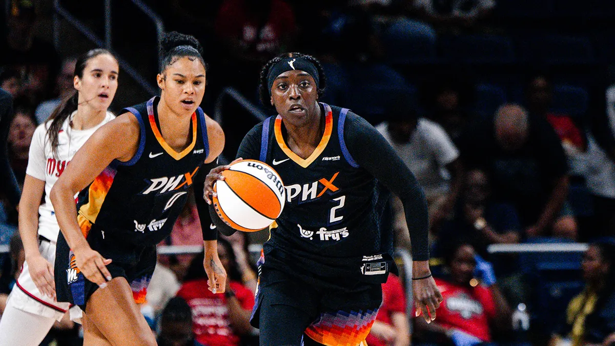 Kahleah Copper dribbling a basketball during a game at CareFirst Arena