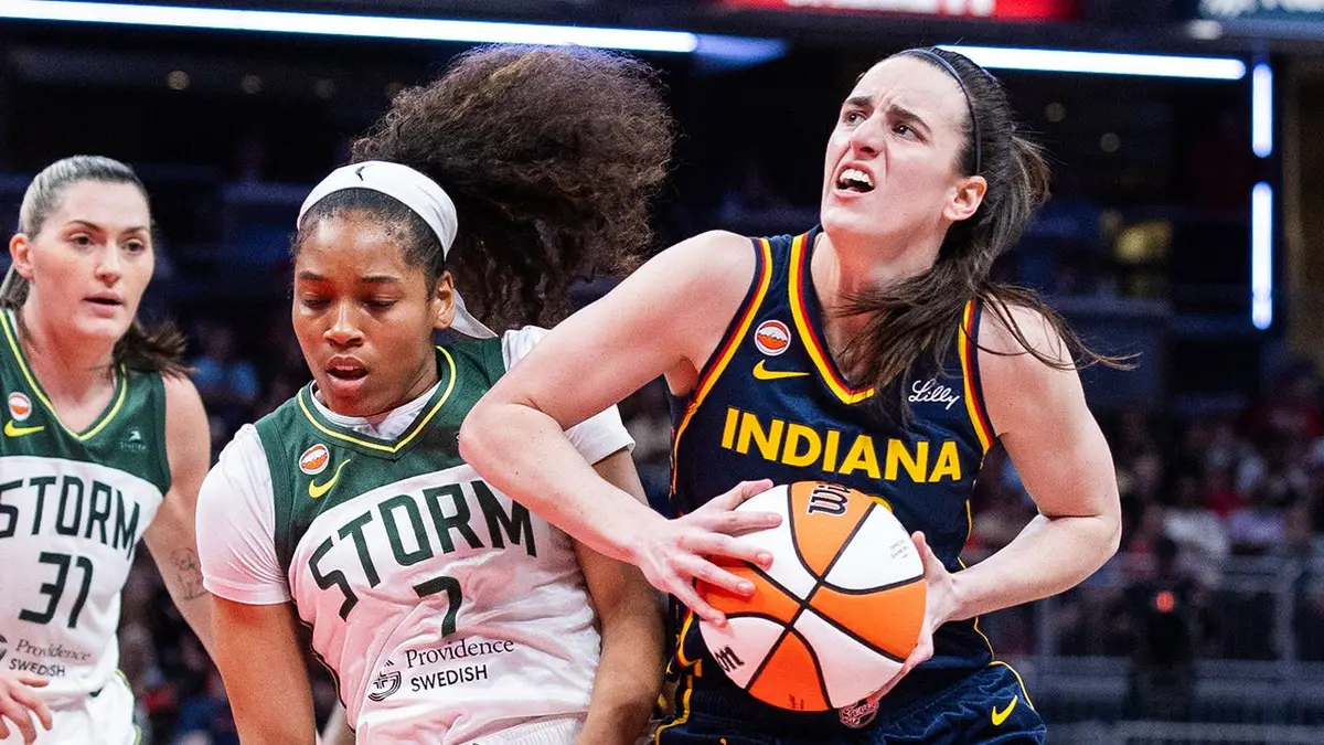 Indiana Fever guard Caitlin Clark shooting basketball against Seattle Storm guard Zia Cooke at Gainbridge Fieldhouse