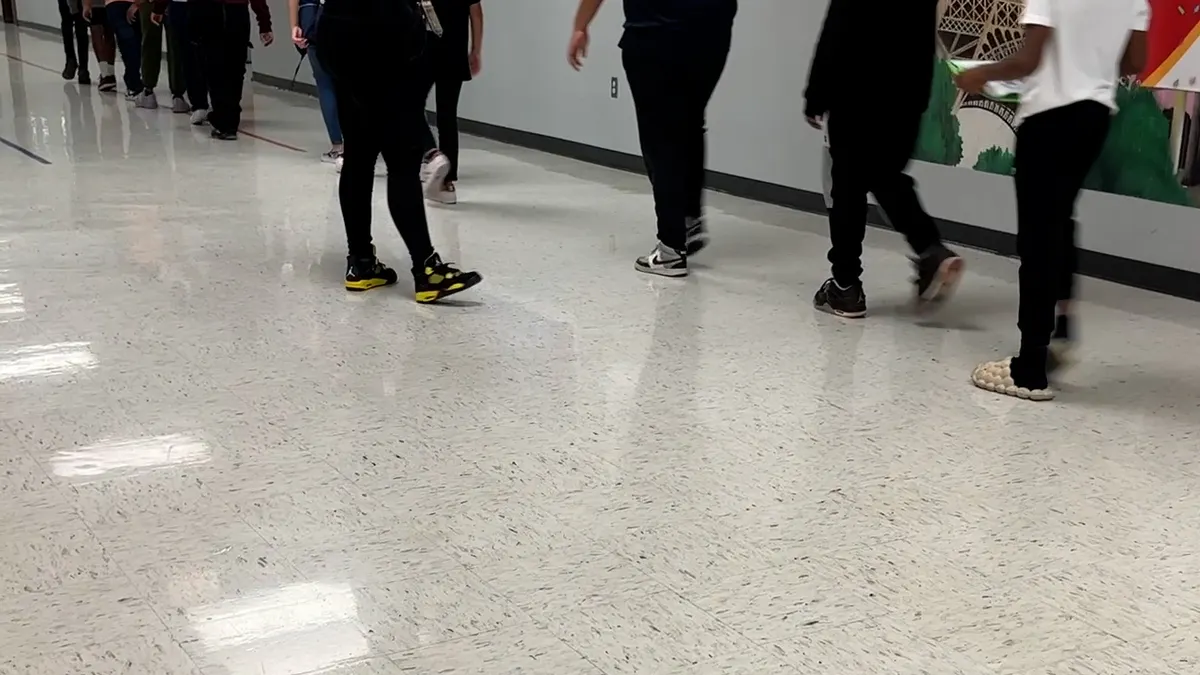 Children walking down school hallways