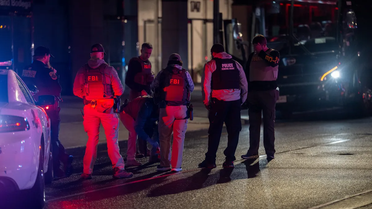 FBI and other federal law enforcement agents at the scene of a shooting near the White House