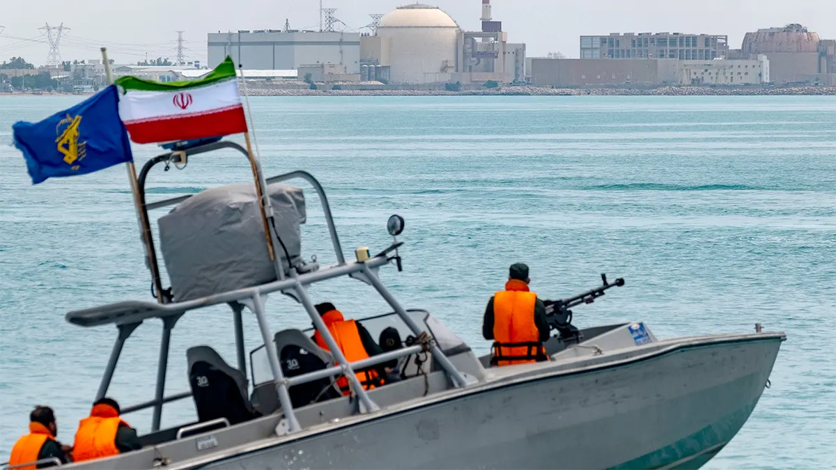 An Islamic Revolutionary Guard Corps speedboat sailing in the Persian Gulf near Bushehr nuclear power plant