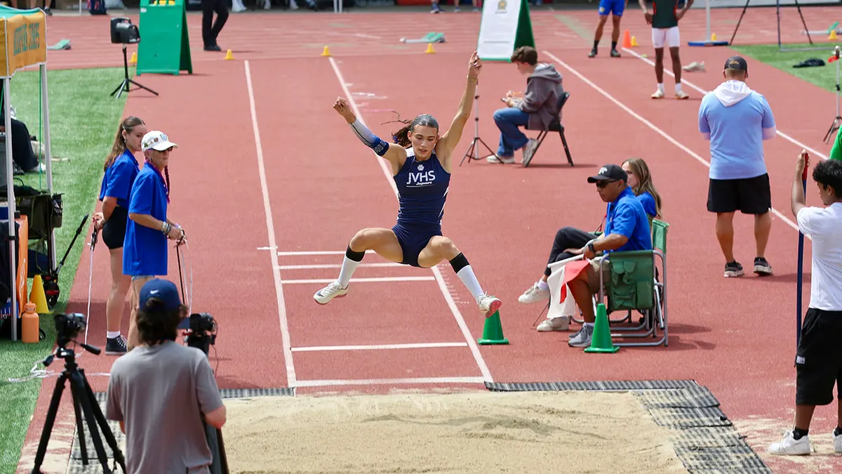 AB Hernandez jumping during girls long jump event at track meet
