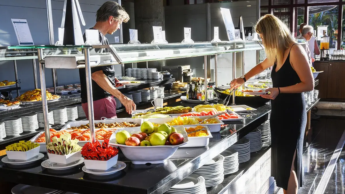Guests help themselves at the breakfast buffet at one of the restaurants in five-star Pestana Casino Park hotel on June 26, 2019 in Funchal, Portugal.