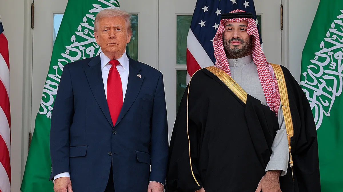 President Donald Trump and Crown Prince Mohammed bin Salman standing along the West Wing Colonnade at the White House