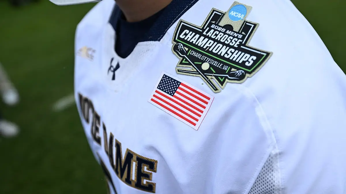 Notre Dame Fighting Irish lacrosse players on field at Scott Stadium