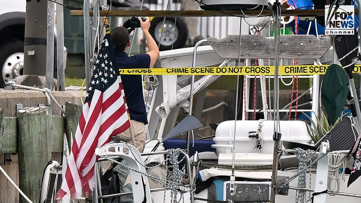 U.S. Coast Guard investigators search Brian Hooker's and his missing wife Lynette Hooker's the boat Soulmate.