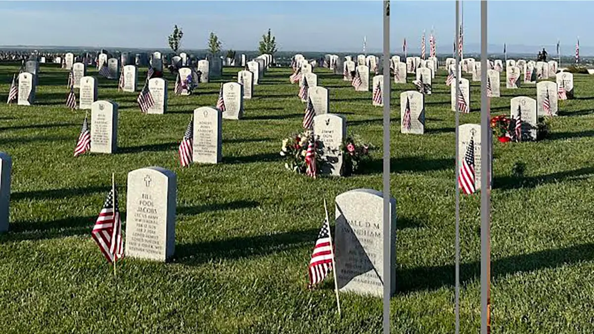Flags placed next to graves at the Idaho Veterans Cemetery in Eagle, Idaho