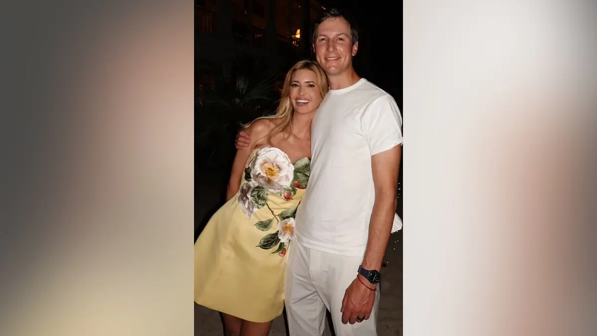 Ivanka Trump wearing a floral yellow dress and Jared Kushner smiling together in the Bahamas.