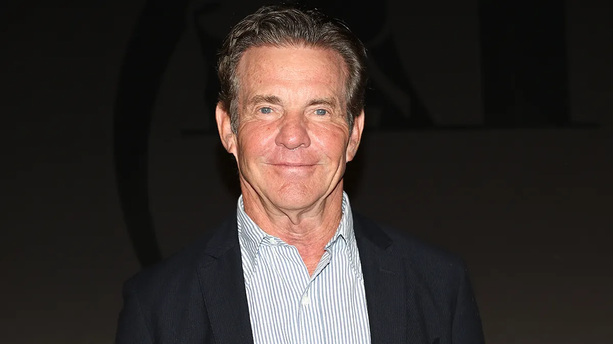 Dennis Quaid posing for photos at the Taormina Film Festival in Italy