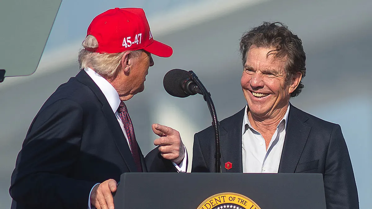 President Donald Trump speaking to actor Dennis Quaid on stage at a rally in Corpus Christi, Texas