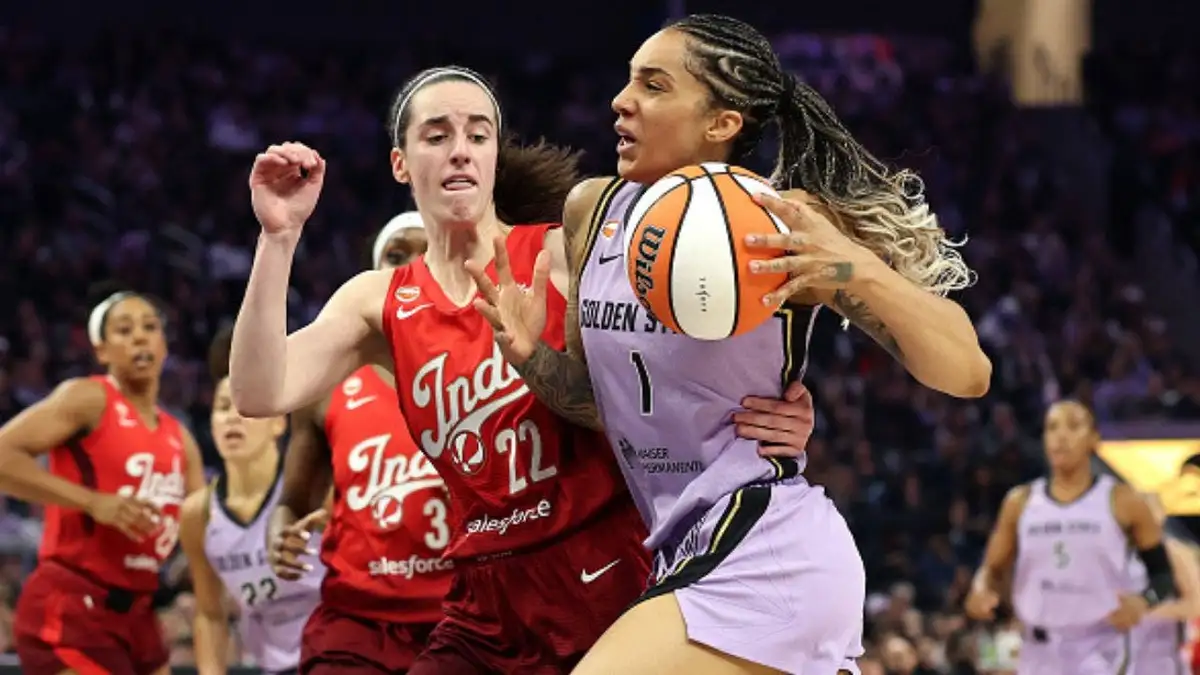 Caitlin Clark made WNBA history again, but Golden State's relentless defense and a hostile crowd powered a narrow win. (Photo by Ezra Shaw/Getty Images)