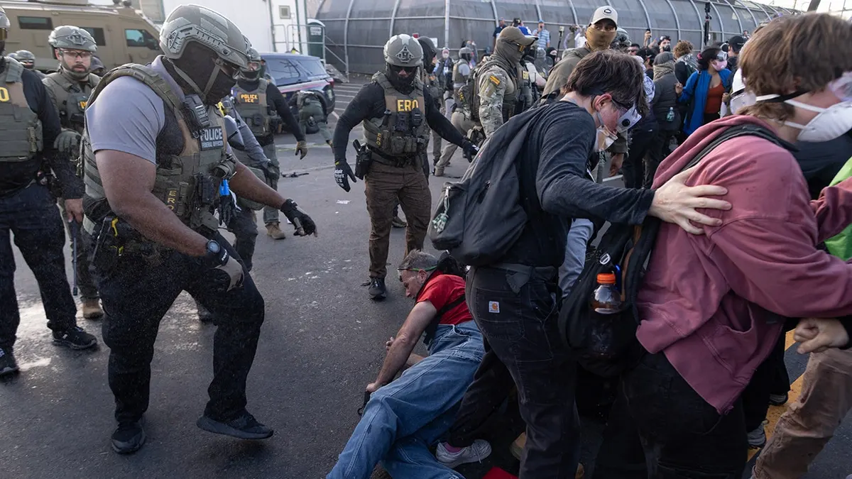 Federal immigration officers clashing with protesters outside Delaney Hall in Newark
