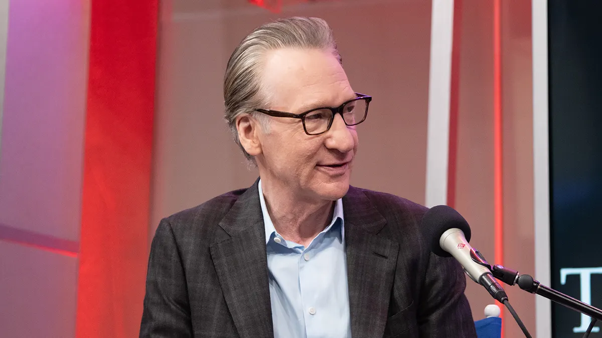Bill Maher standing inside SiriusXM Studios in New York City