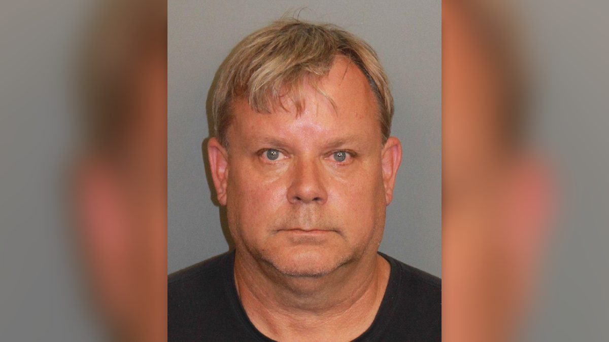 Jeffrey Towers wearing a black T-shirt in his Jefferson County mugshot