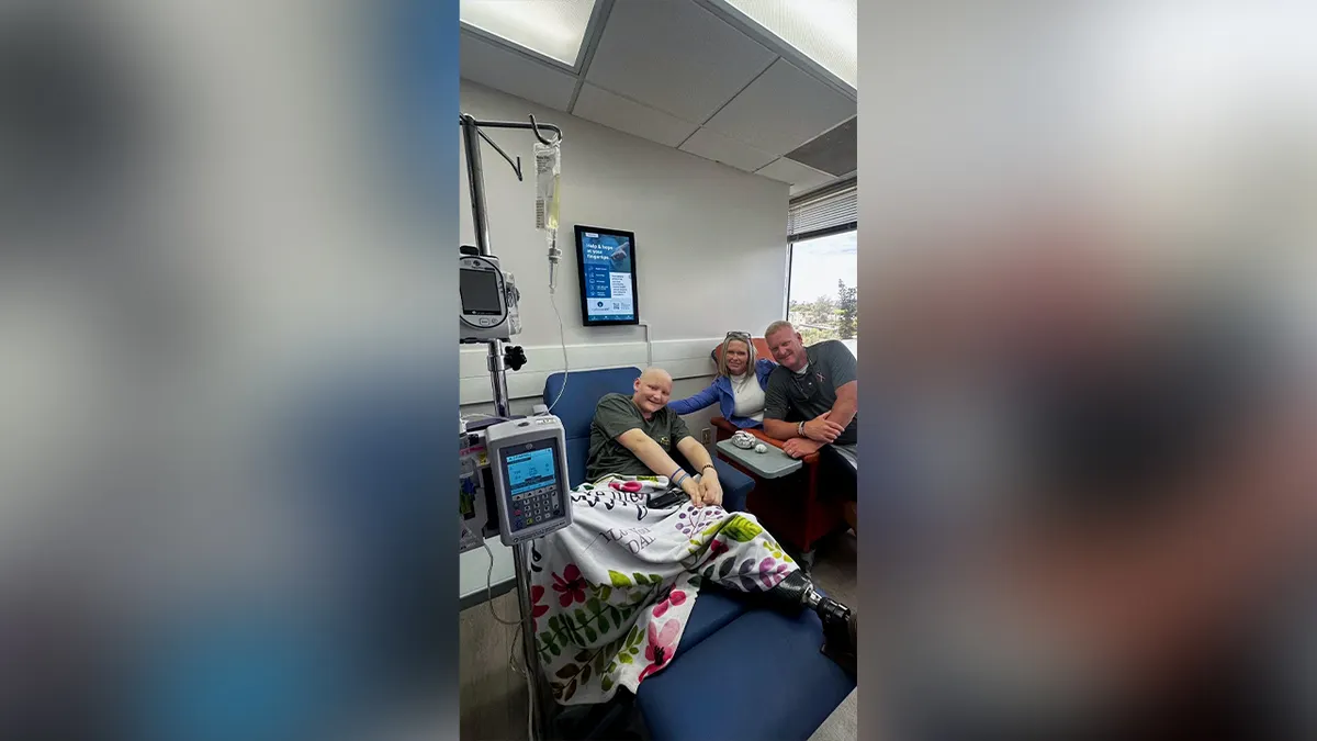 will roberts smiling with family in clinic