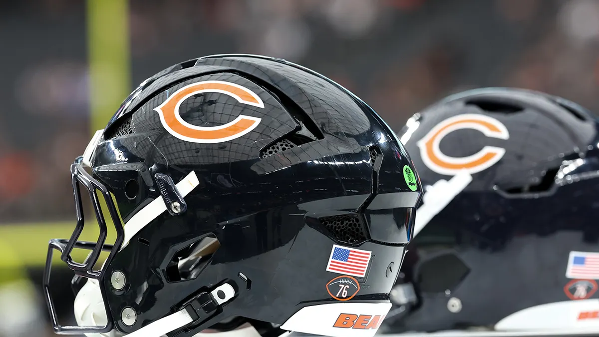 Chicago Bears helmets arranged on a table at Allegiant Stadium.