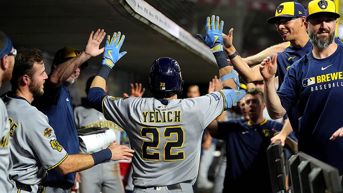 Christian Yelich celebrating after hitting a home run at Great American Ball Park