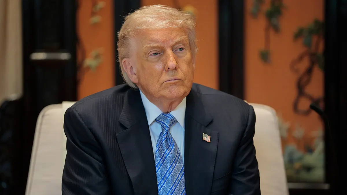 U.S. President Donald Trump looking on during a meeting in Beijing