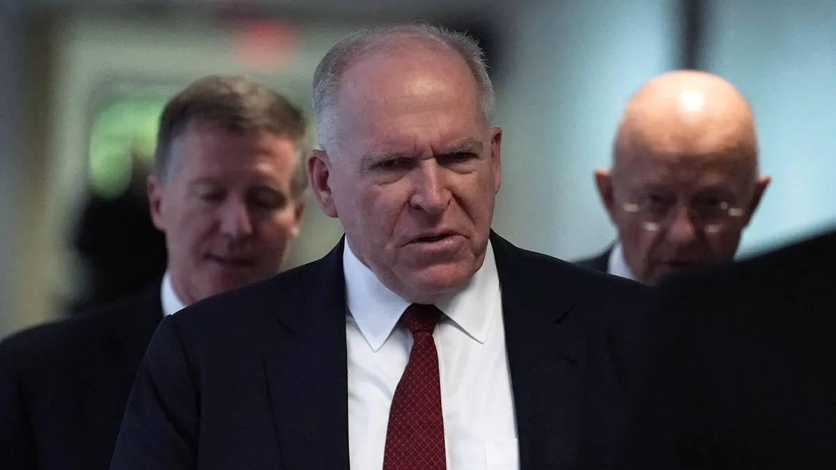 Former CIA director John Brennan and former director of National Intelligence James Clapper arriving at a Senate Intelligence Committee hearing