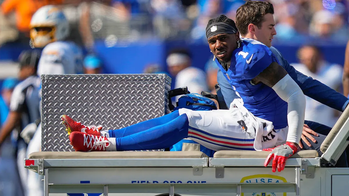 New York Giants wide receiver Malik Nabers being driven off the field on a medical cart
