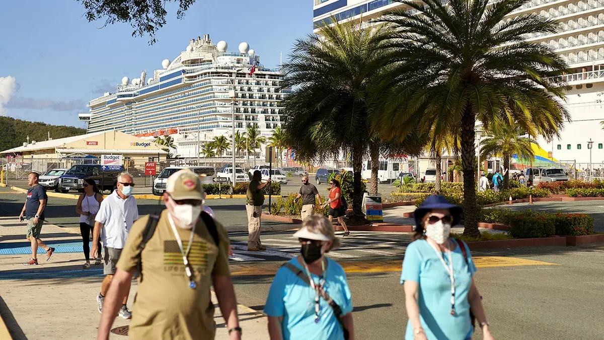 Passengers exiting Norwegian Encore and Regal Princess cruise ships
