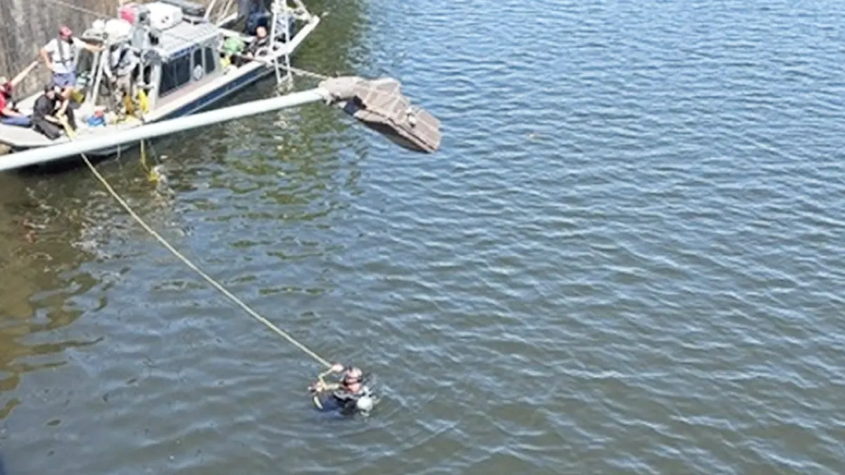 An IED is fished out of the Converse Reservoir in Mobile, Alabama.