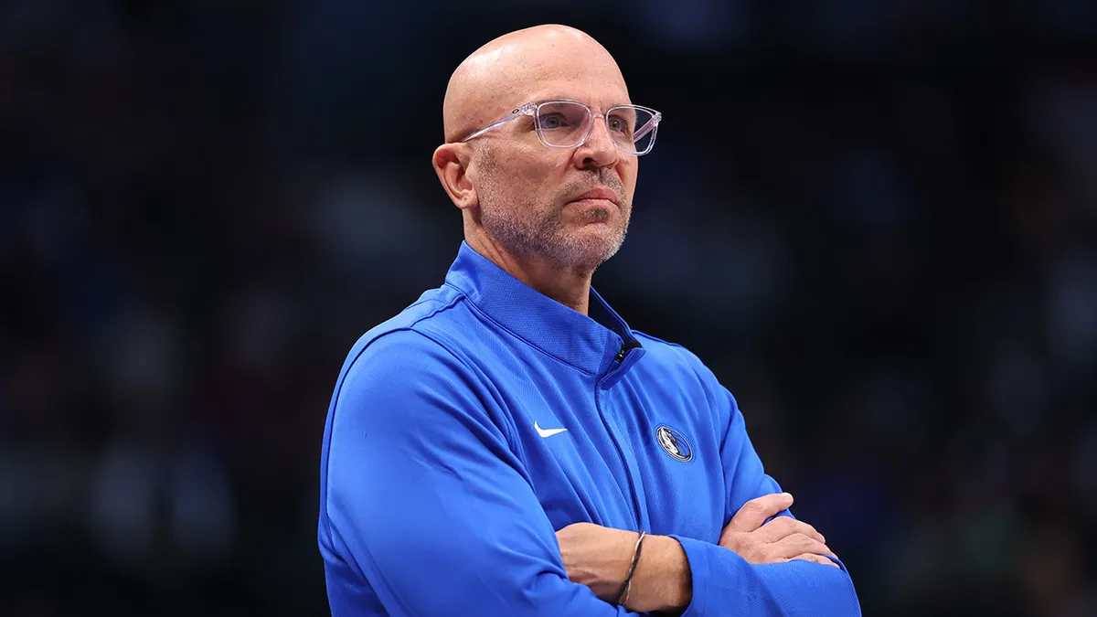 Head coach Jason Kidd of the Dallas Mavericks looking on during a basketball game.