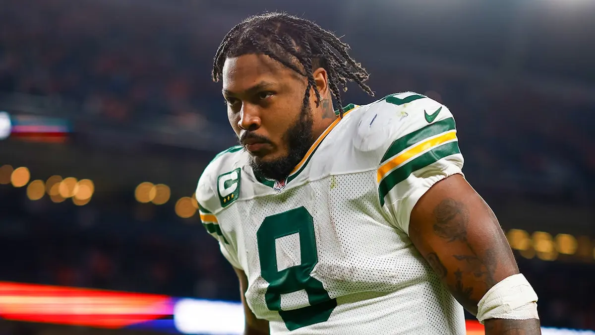 Josh Jacobs jogging off the field wearing Green Bay Packers uniform