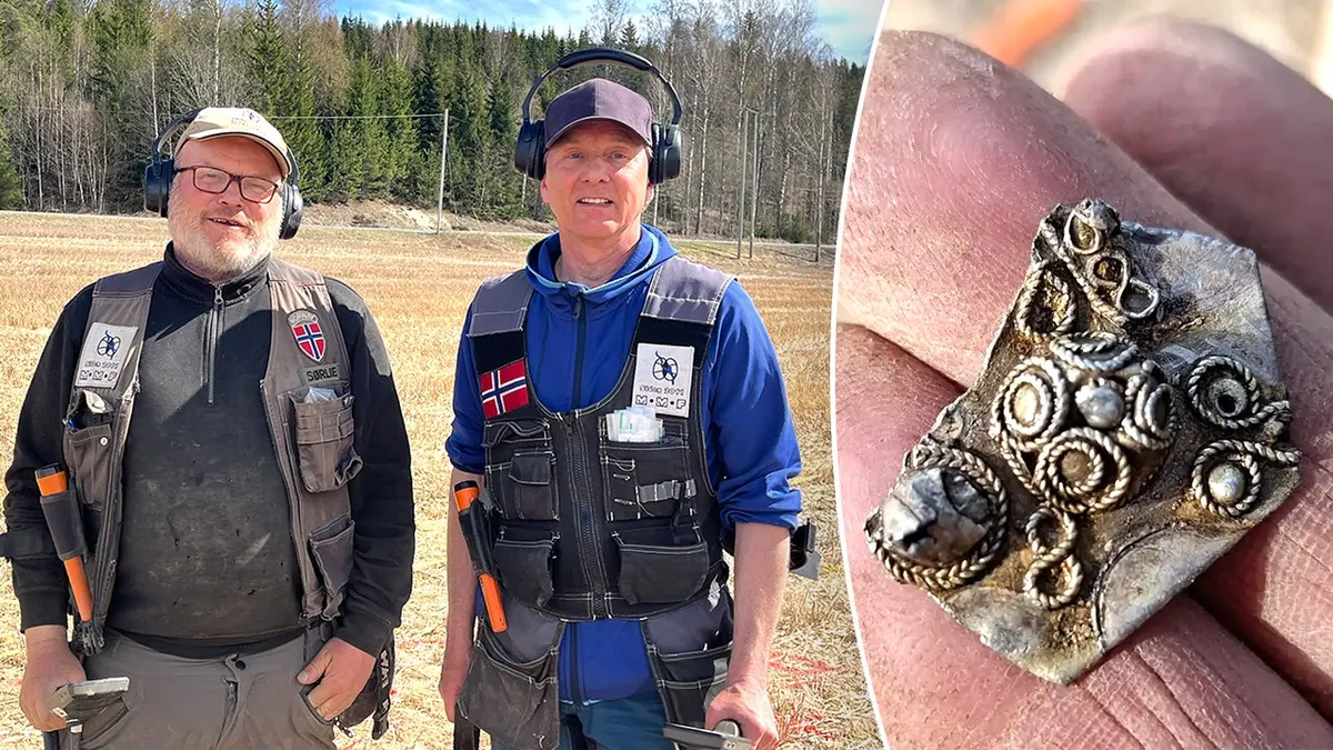 View of metal detectorists, hand holding coin