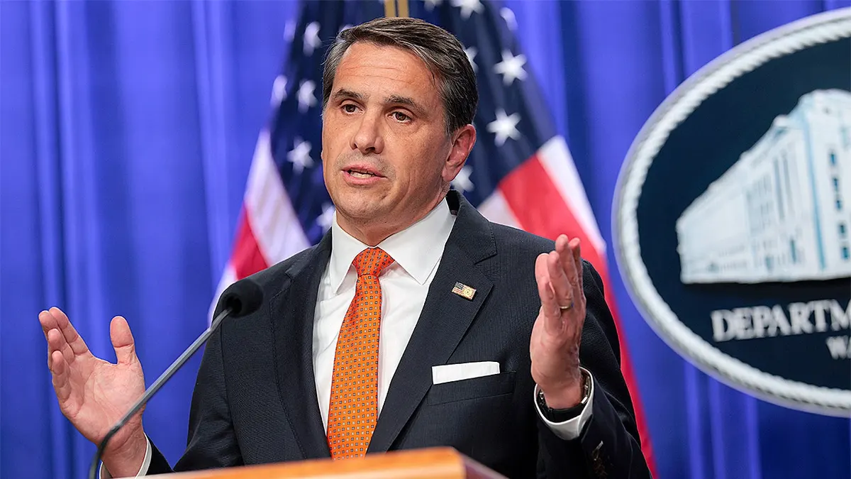 Acting U.S. Attorney General Todd Blanche speaking at a news conference indoors