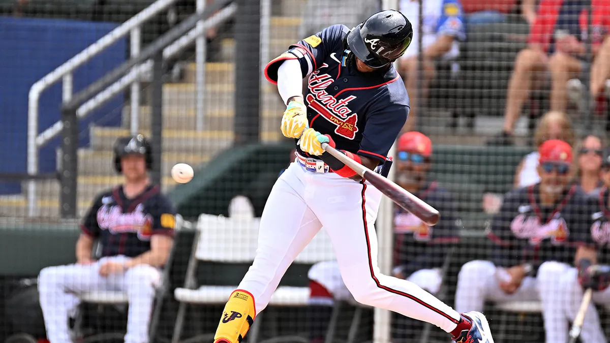 Jurickson Profar hitting a sacrifice fly during spring training at CoolToday Park