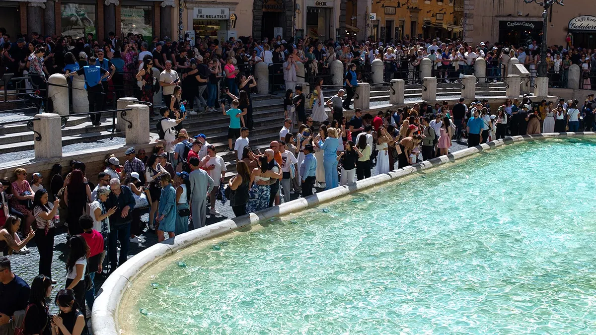 Tourists visiting the Trevi Fountain in Rome, Italy