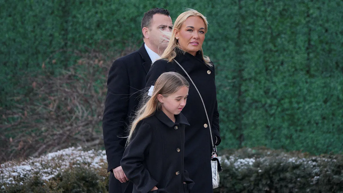 Vanessa Trump walking outside St. John's Church wearing a coat