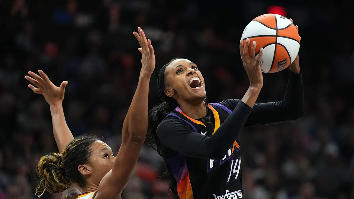 Phoenix Mercury forward DeWanna Bonner shooting over Indiana Fever guard Aerial Powers at PHX Arena