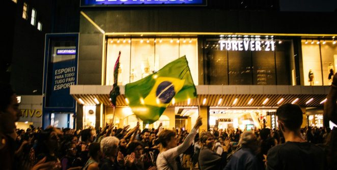 a crowd of people standing in front of a building