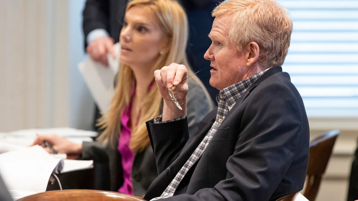 Alex Murdaugh sitting with legal team inside courtroom during jury selection