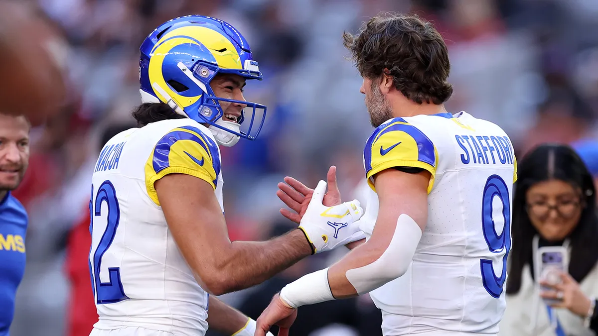 Wide receiver Puka Nacua greets quarterback Matthew Stafford at State Farm Stadium.