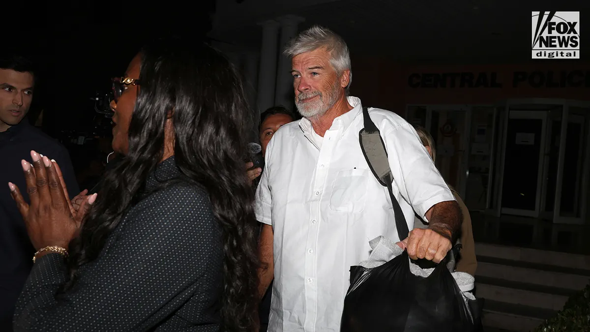 Brian Hooker leaves police station in The Bahamas, with lawyer
